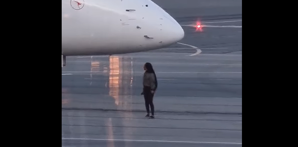 Video zeigt, wie Frau Flug verpasst, Sicherheit umgeht und unter Flugzeug läuft
